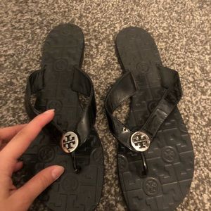 Tory Burch Black Thora Flip Flops silver logo